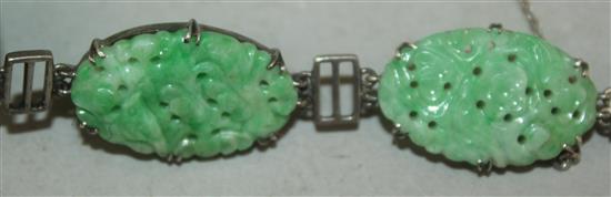 A Chinese jadeite and silver mounted bracelet, 20th century, each jadeite plaque approx. 2.5cm